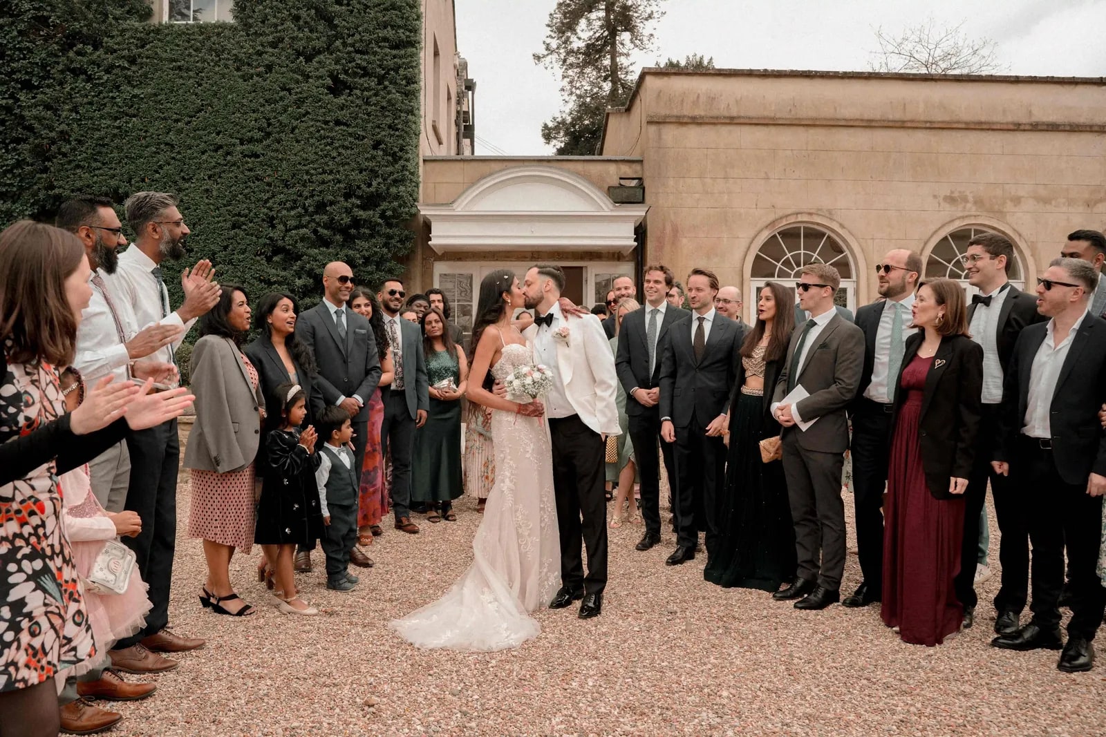 Guests lining the drive to applaud the couple as they pass