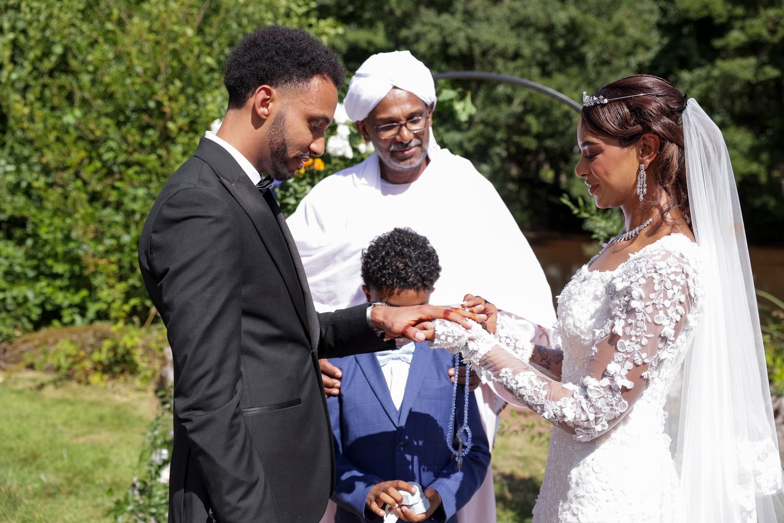 The couple's hands joined by the celebrant during the blessing