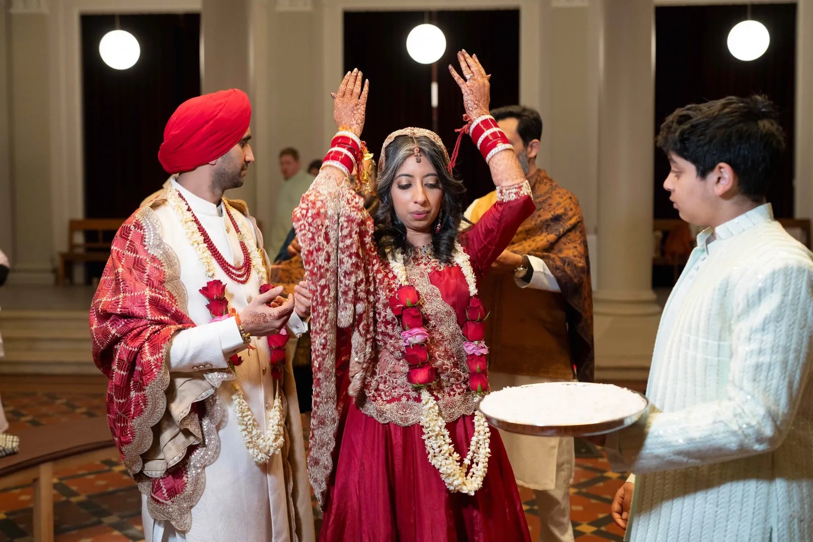 A blessing being given over the bride's head at the end of the ceremony