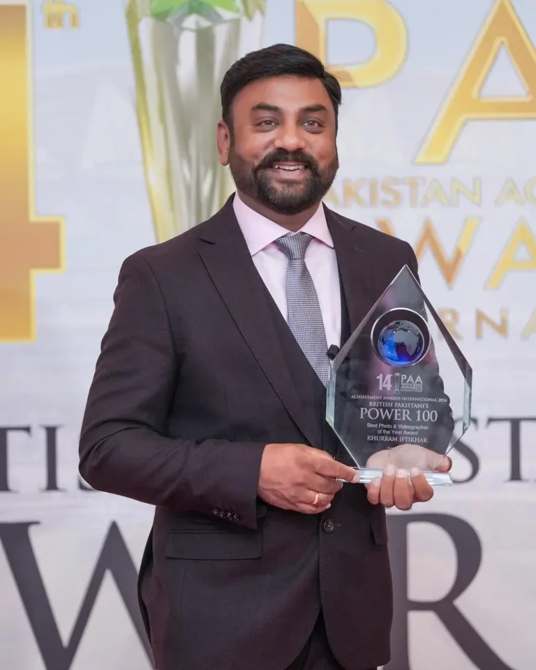 Khurram Iftikhar holding the Best Photo and Videographer of the Year award at the Pakistan Achievement Awards International 2024