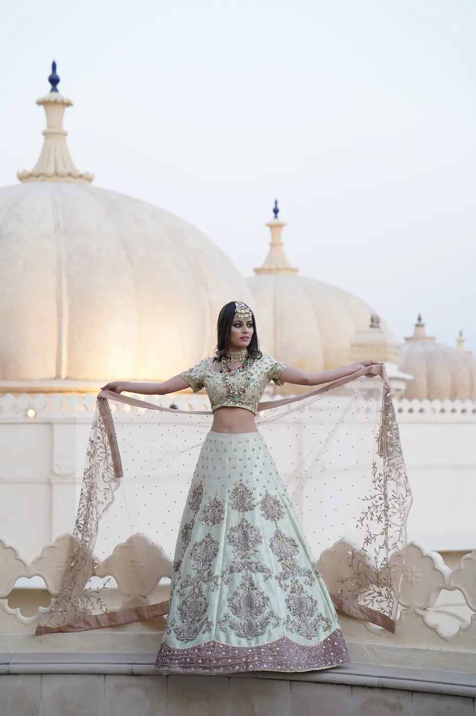 Asian bride wearing a light gr