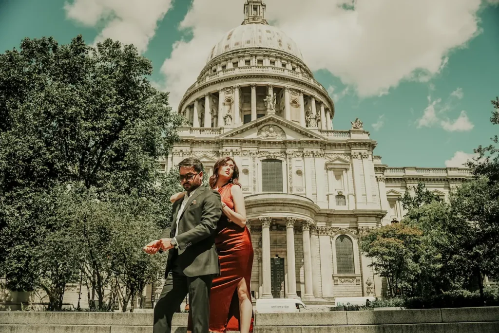 Romantic pre-wedding photoshoot in London featuring a couple posing in front of St Paul's Cathedral